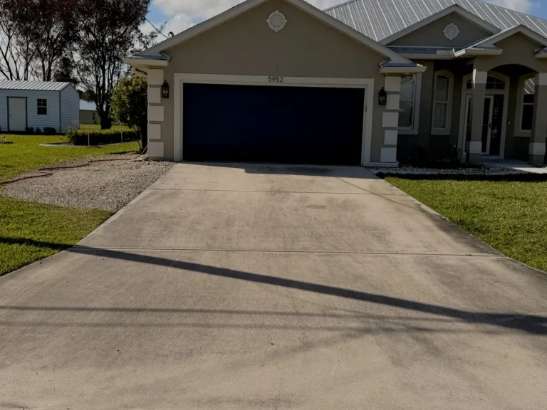 Clean concrete driveway after pressure washing in Port St. Lucie
