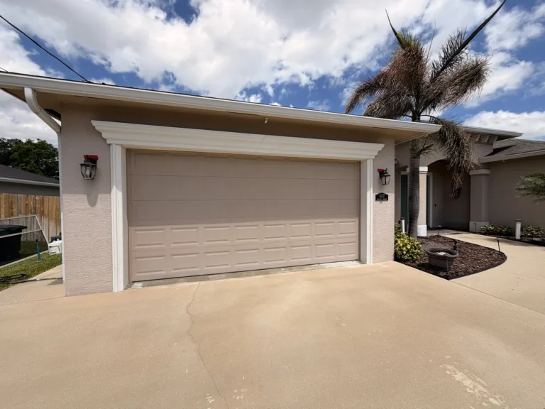 Concrete driveway and garage after pressure washing