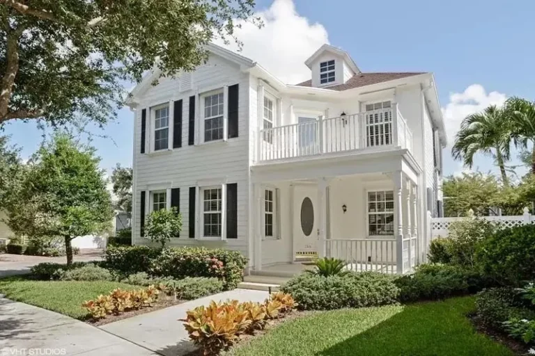 Two-story home after house washing by AquaFlow Pro Wash