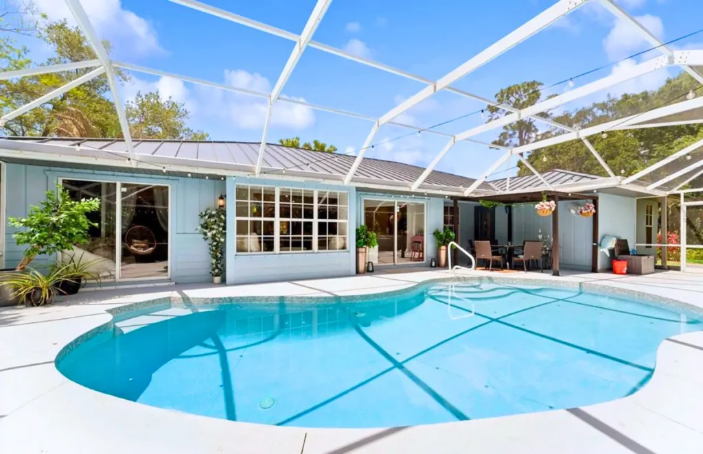 Clean pool cage and screen enclosure over a pool in Port St. Lucie