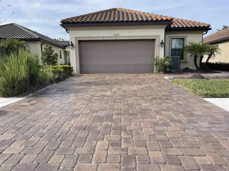 Paver driveway after cleaning and sealing by AquaFlow Pro Wash