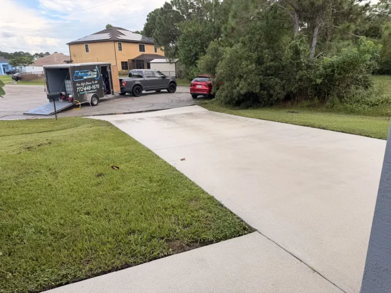 AquaFlow Pro Wash trailer parked at a house washing job in Port St. Lucie