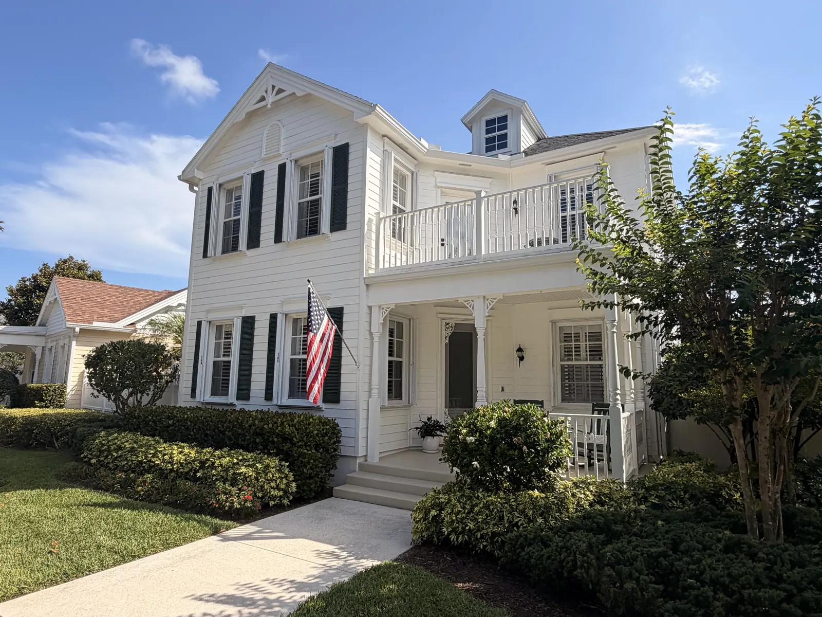 Two-story home after an AquaFlow Pro Wash house wash