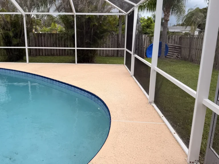 The same pool deck and screen enclosure corner after cleaning