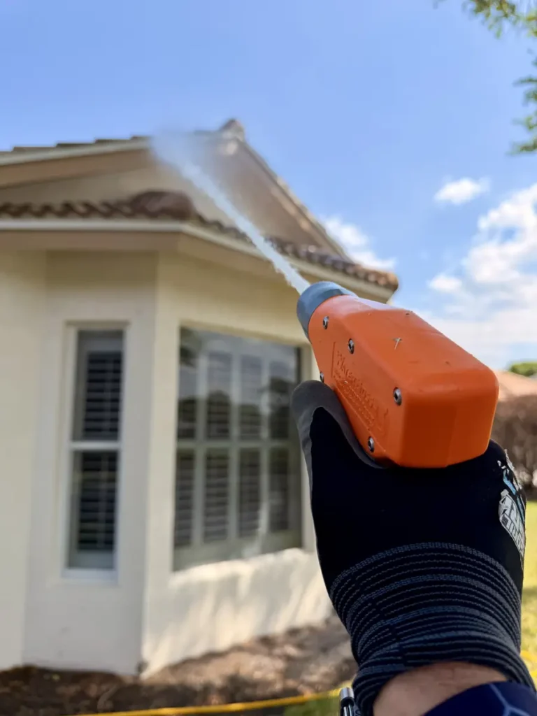 AquaFlow soft-wash application on the stucco around a bay window in Port St. Lucie